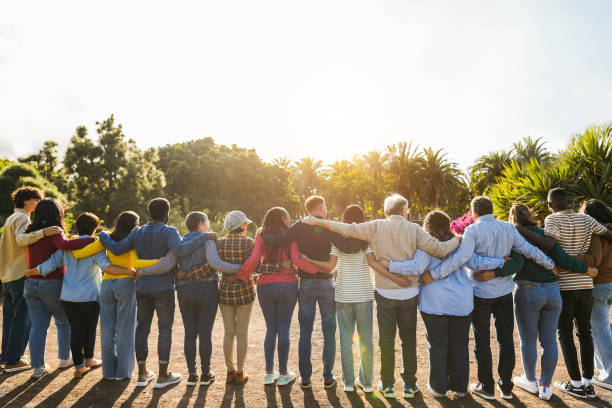 People helping each other across a bridge